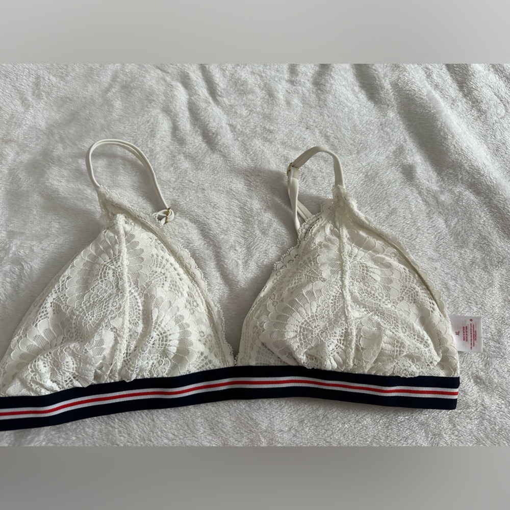 Target never worn bikini top. White with blue and red trim. Lace front.